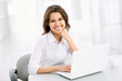Business woman working at laptop