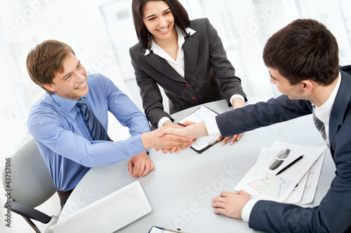 Photo: Business people shaking hands Business people shaking hands