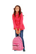 school girl child trying to lift heavy backpack