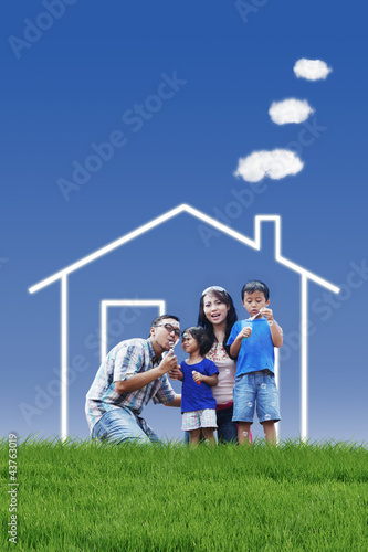 Photo: Family with dream house Family with dream house