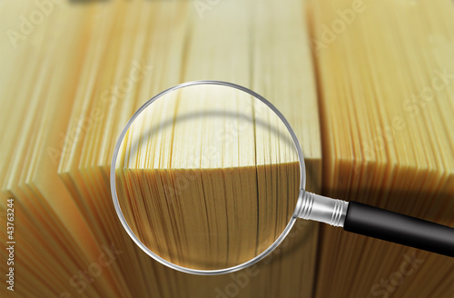 Photo: loupe and book loupe and book