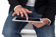 Foto: Man working on a tablet pc Man working on a tablet pc