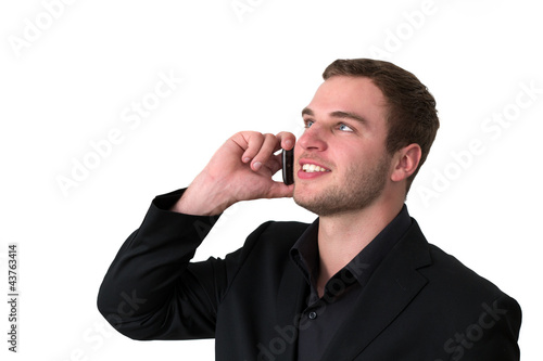 Photo: Young Man in jacket talking on the phone Young Man in jacket talking on the phone