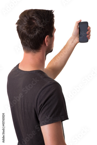 Photo: Young Man Working On His Smartphone Young Man Working On His Smartphone