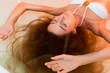Foto: Wellness - young woman floating in Spa or swimming pool Wellness - young woman floating in Spa or swimming pool