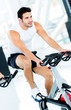Man doing spinning at the gym