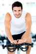 Man cycling at the gym