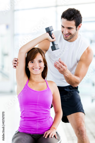 Photo: Woman with a personal trainer Woman with a personal trainer