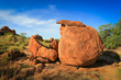 Granite eroded red rock formation, big stone pebbles geology by