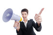 Young business lady screaming to loudspeaker