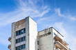 shabby municipal house under blue sky