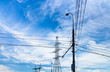 Electric power transmission under white cirrus clouds