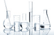 Group of laboratory flasks with a clear liquid, isolated
