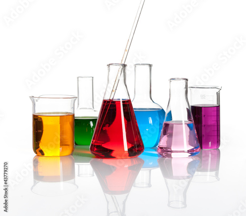 Photo: Various laboratory flasks with a colored reagents, isolated Various laboratory flasks with a colored reagents, isolated