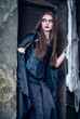 Portrait of a young witch. Halloween, horror.