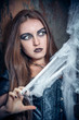 Portrait of a young witch. Halloween, horror.