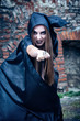 Portrait of a young witch. Halloween, horror.