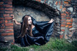 Photo: Portrait of a young witch. Halloween, horror. Portrait of a young witch. Halloween, horror.