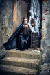 Photo: Portrait of a young witch. Halloween, horror. Portrait of a young witch. Halloween, horror.