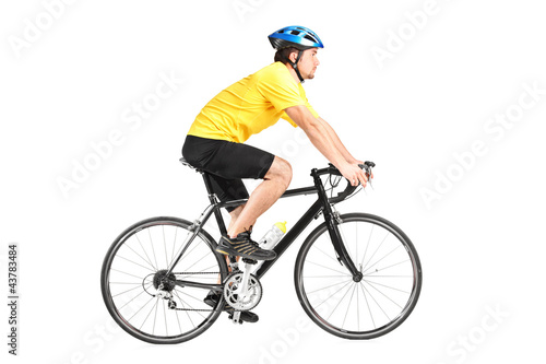 Photo: Full length portrait of a man riding a bycicle Full length portrait of a man riding a bycicle