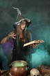 Foto: Halloween withch on smoky green and purple background Halloween withch on smoky green and purple background