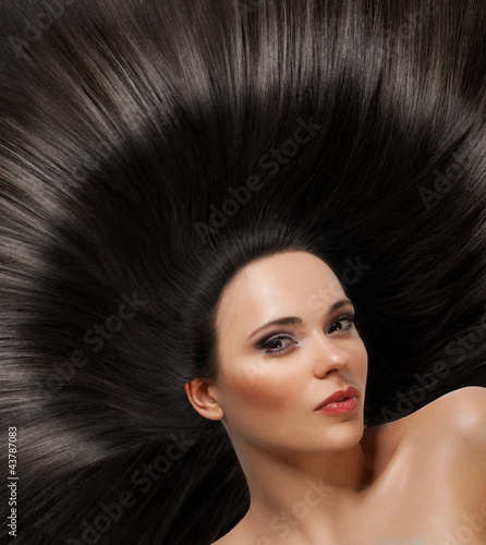 Photo: Beautiful Brunette Girl. Healthy Long Hair Beautiful Brunette Girl. Healthy Long Hair