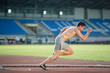 Professional sprinter during training, starting from the startin
