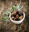 Bowl filled with black olives