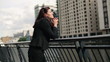 Video: Portrait of young businesswoman relaxing in the city Portrait of young businesswoman relaxing in the city