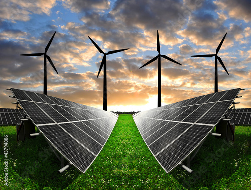 Photo: Solar energy panels with wind turbines in the sunset Solar energy panels with wind turbines in the sunset