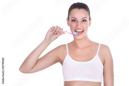 Photo: Happy woman with tooth-brush Happy woman with tooth-brush