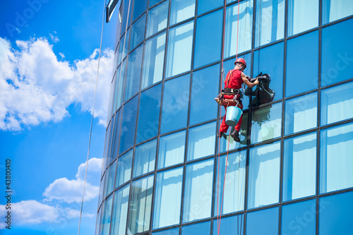 Photo: Window washer building windows from outside Window washer building windows from outside