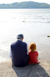 Girl With Her Granddad Together On A Pier