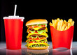 Tasty hamburger and french fries on a dark