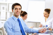 Foto: Young businessman in the office Young businessman in the office