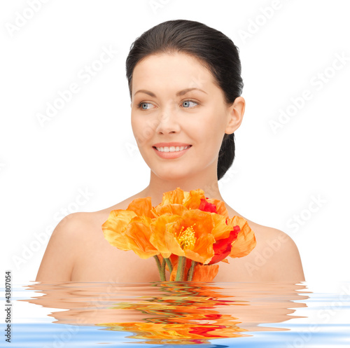 Foto: lovely woman with red flowers lovely woman with red flowers