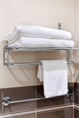 Photo: Clean white towel on a hanger Clean white towel on a hanger