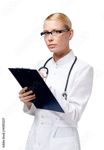 Foto: Female practitioner writes in her notebook, isolated on white Female practitioner writes in her notebook, isolated on white