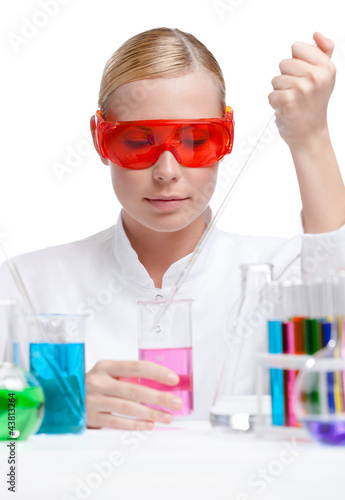 Photo: Investigator tests purple liquid in beaker, isolated on white Investigator tests purple liquid in beaker, isolated on white