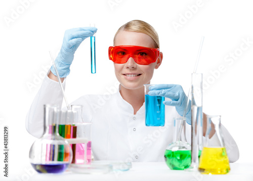 Photo: Female doctor in spectacles does some experiments Female doctor in spectacles does some experiments