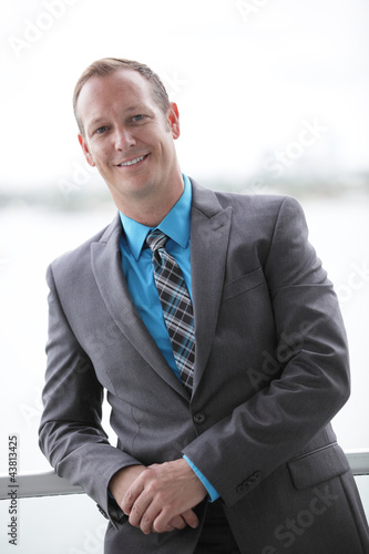 Photo: Businessman leaning on the ledge Businessman leaning on the ledge