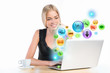 Young woman using her laptop for multimedia and site surfing. Di