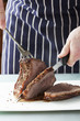 Roast meat is being carved