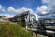 industrial pipelines and smokestack with a natural blue backgrou