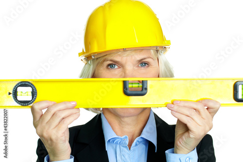 Foto: Woman with measuring tool Woman with measuring tool