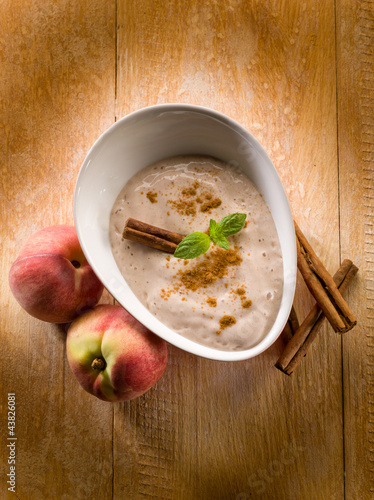 Photo: peach mousse with cinnamon and mint leaf peach mousse with cinnamon and mint leaf