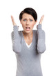 Perplexed woman puts her hands on the head, isolated on white