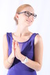 Attractive young woman with eyeglasses clapping her hands