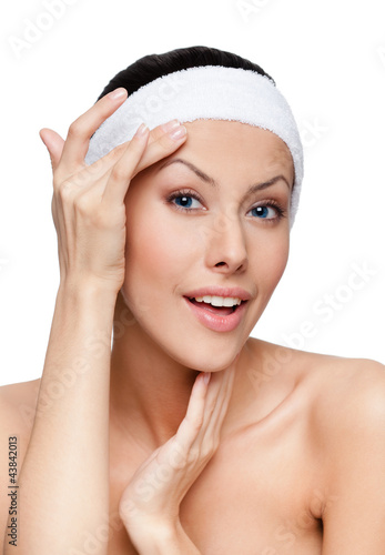 Foto: Admiration after making a facelift, isolated, white background Admiration after making a facelift, isolated, white background