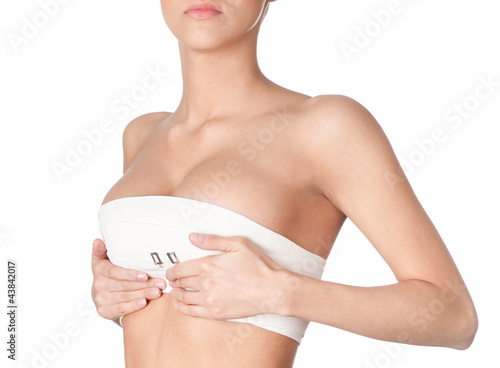 Photo: Preparing to breast correction, isolated, white background Preparing to breast correction, isolated, white background